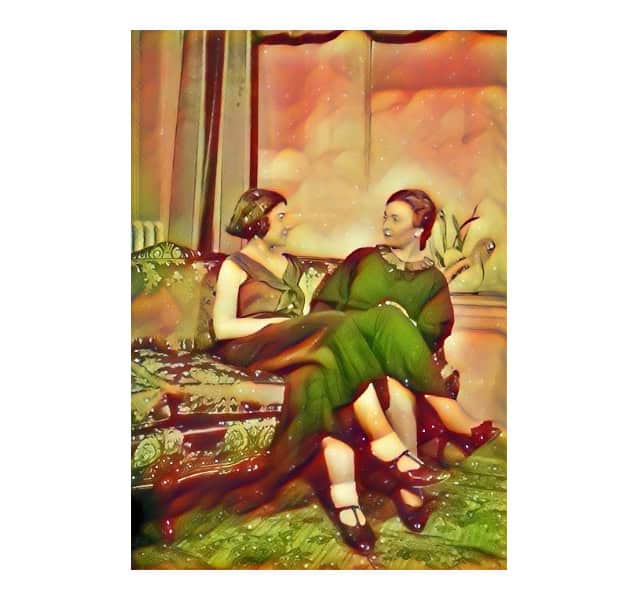 An artistic, highly stylized image of two women seated on a patterned sofa, both wearing dresses. The vibrant colors and fluid lines give the image a surreal, dream-like quality as they engage in conversation.